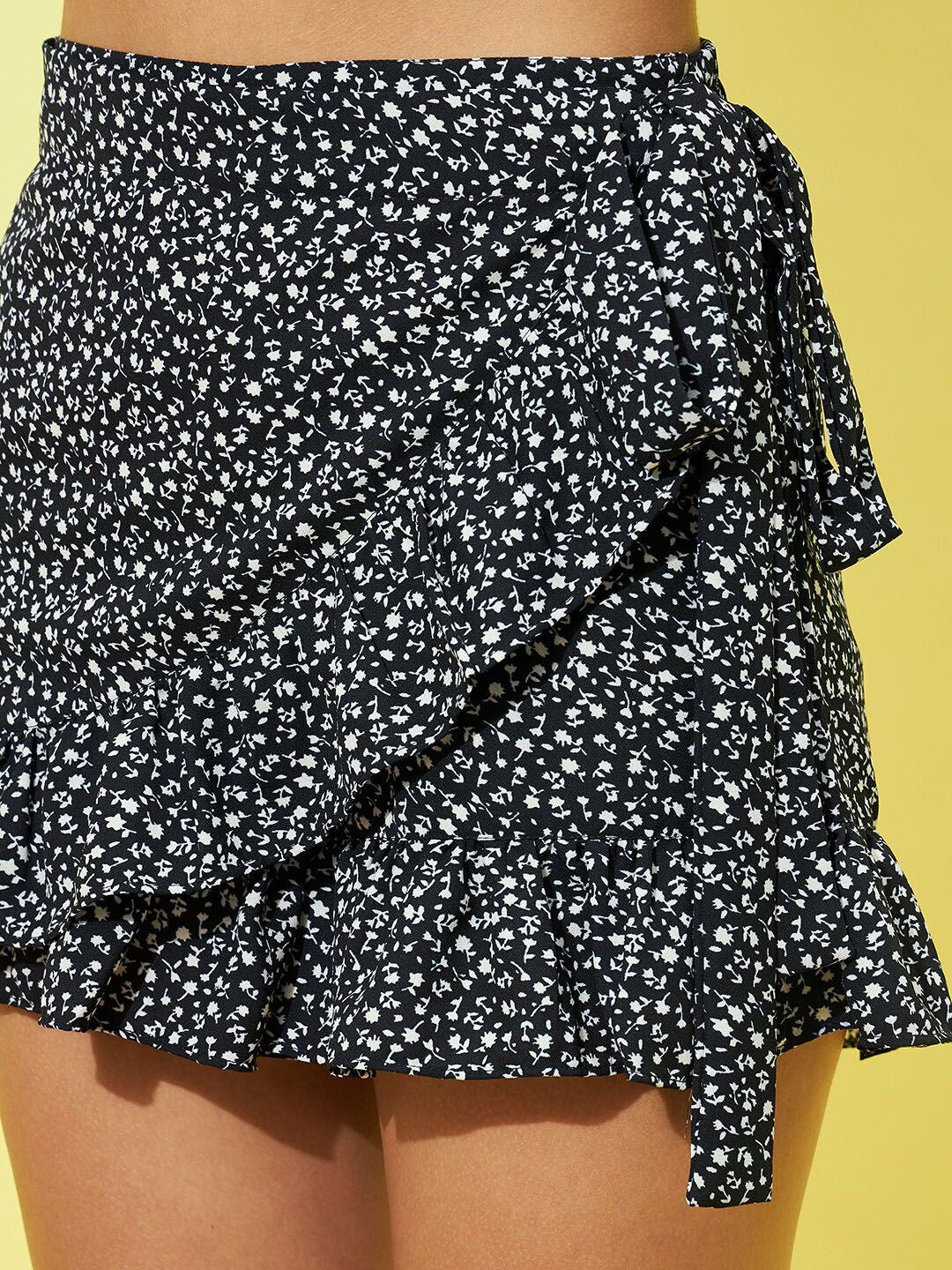 Berrylush Women Black Floral Printed Tie-Up Ruffled Wrap Mini Skorts