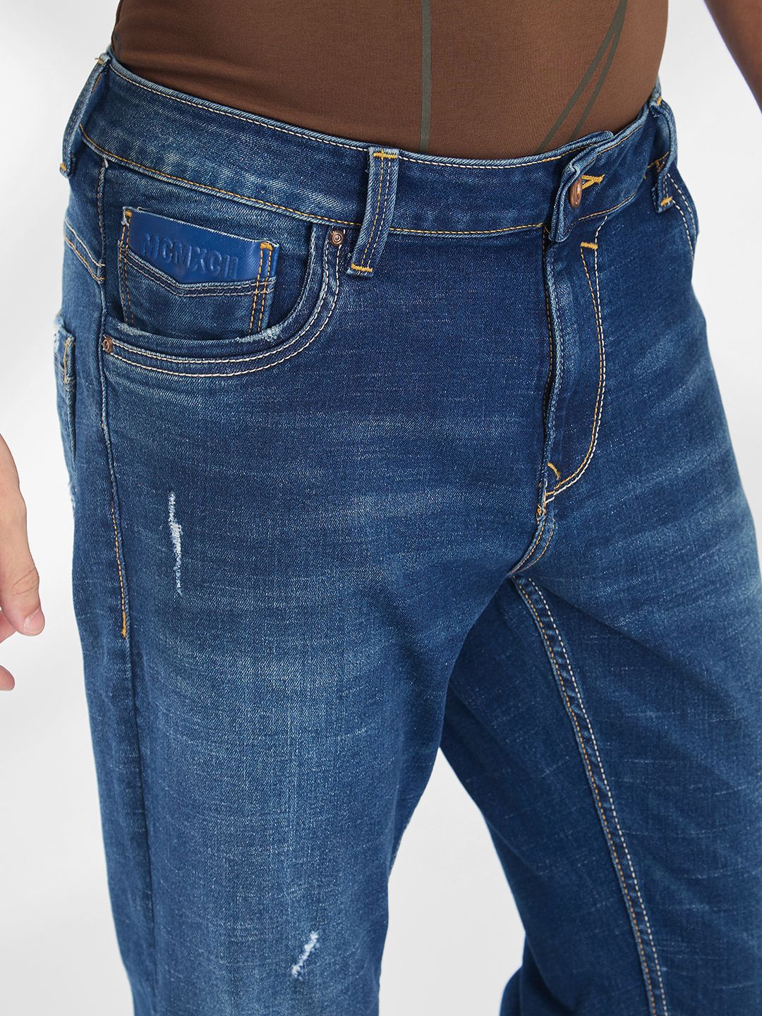 SPYKAR Men Mildly Distressed Light Fade Stretchable Mid-Rise Jeans