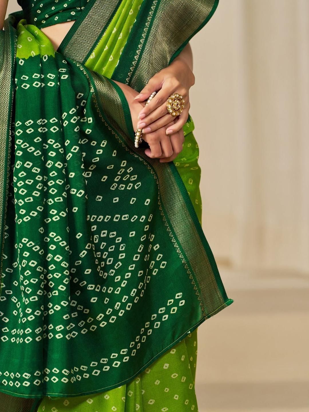 Kalini Women Dola Silk Bandhani Print Zari border Saree