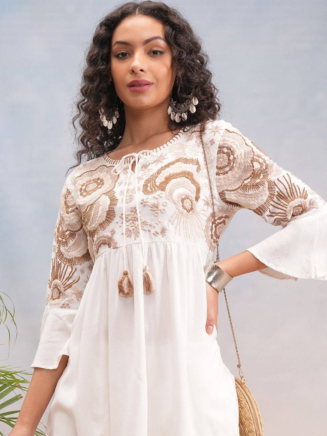 Vishudh Off White Floral Embroidered Bell Sleeves Tie-up Neck Tunic With Trousers