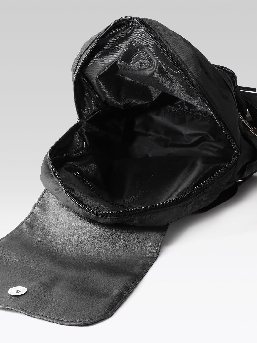 DressBerry Women Solid Tasselled Detail Backpack