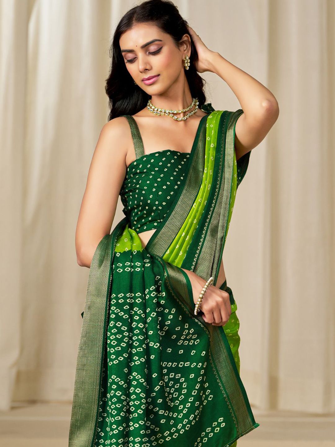 Kalini Women Dola Silk Bandhani Print Zari border Saree