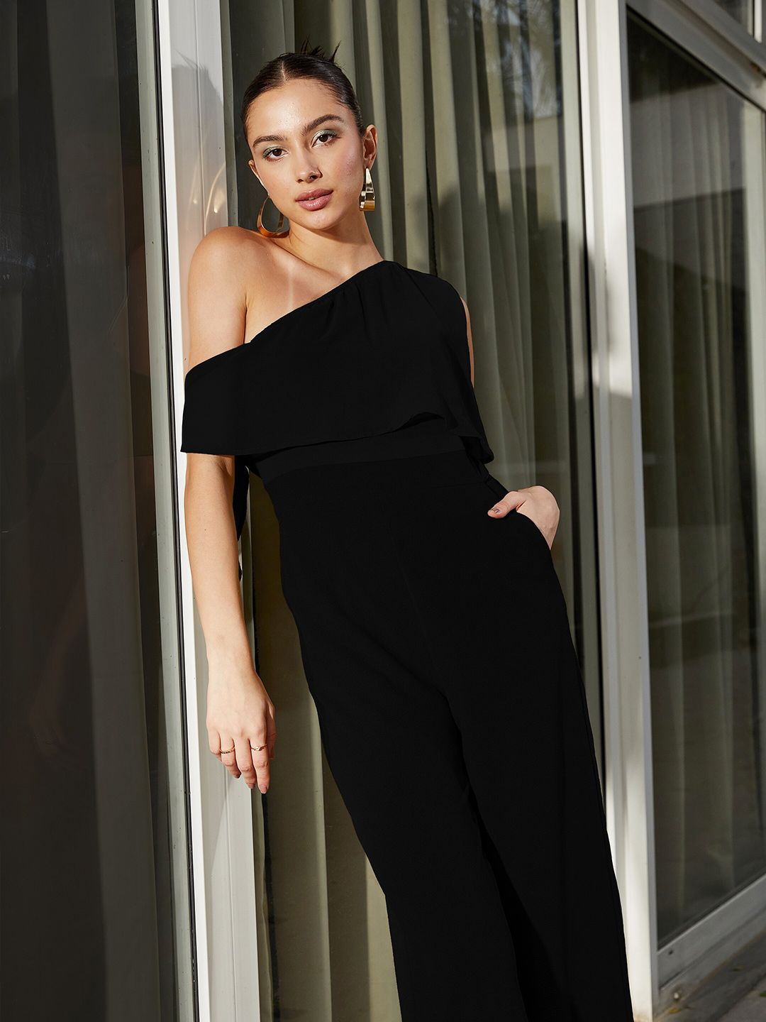 SASSAFRAS Black One Shoulder Basic Jumpsuit with Ruffles