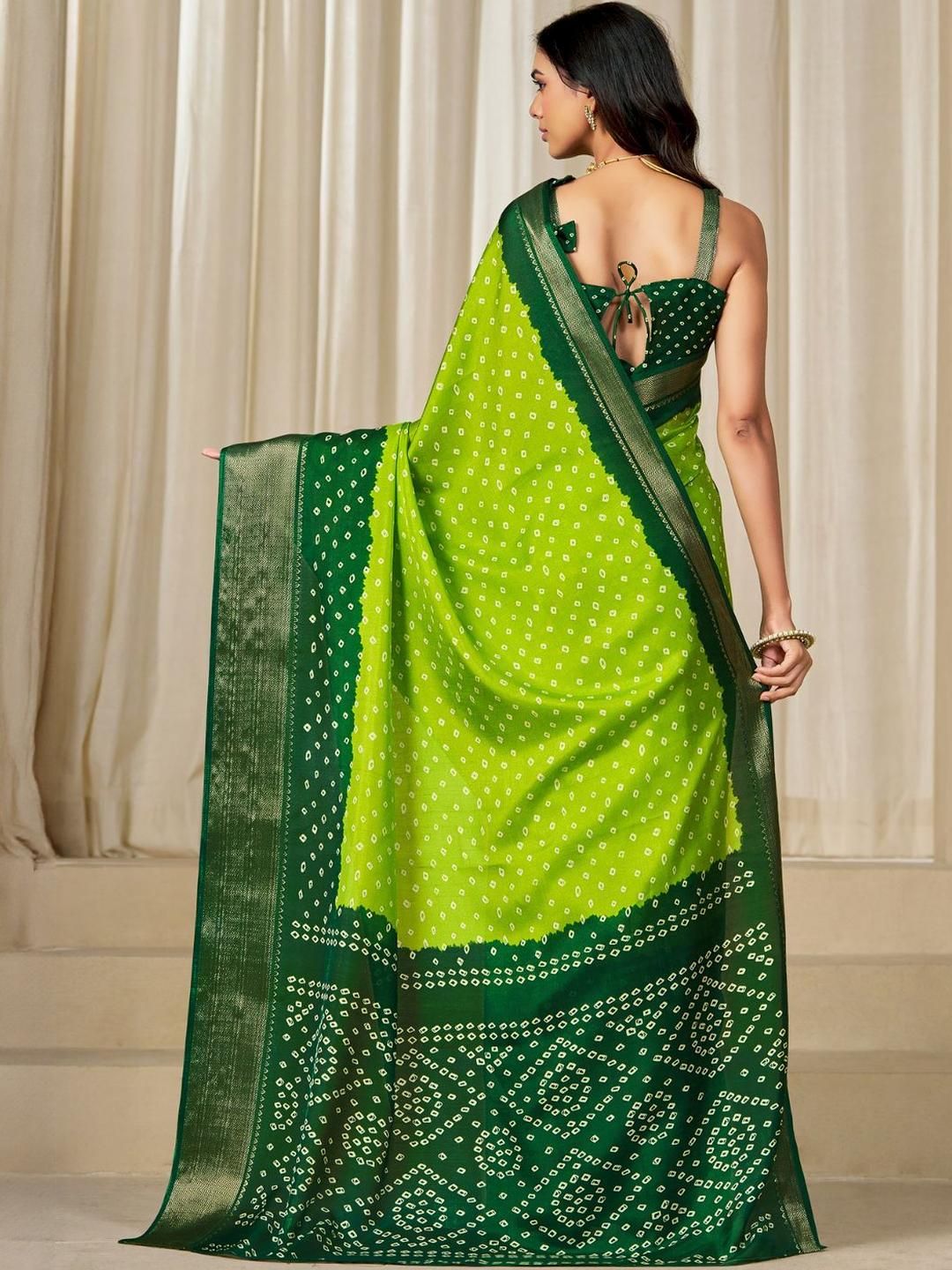 Kalini Women Dola Silk Bandhani Print Zari border Saree