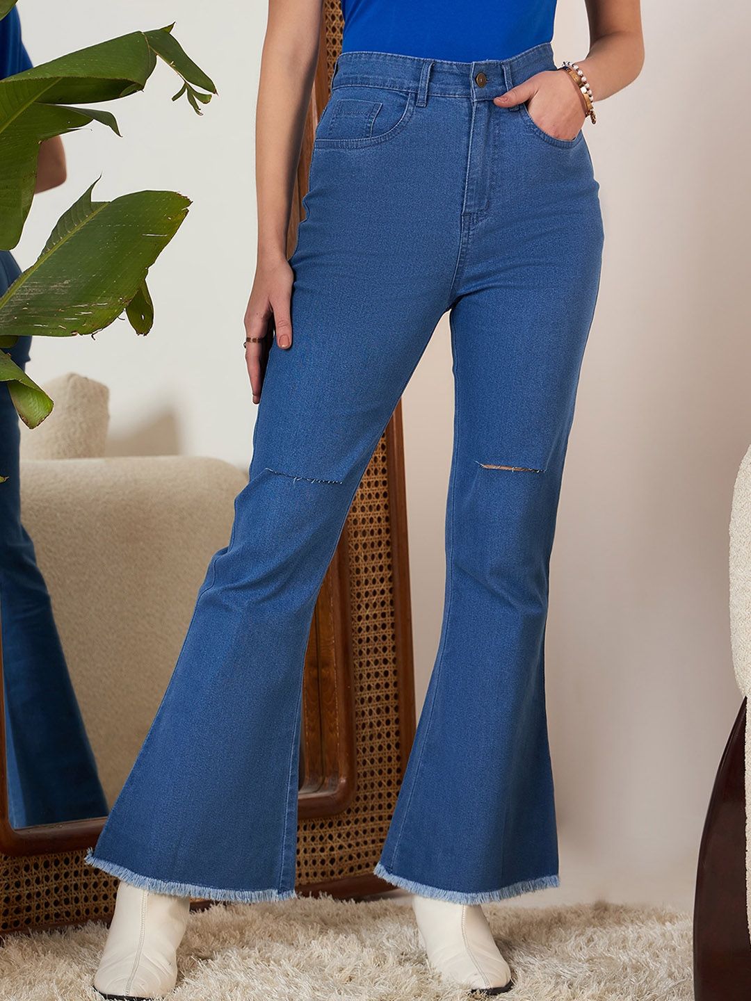 Berrylush Blue Women Bootcut High-Rise Mildly Distressed Stretchable Light Fade Jeans