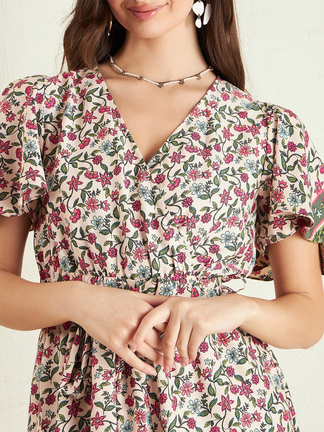 Berrylush Pink Floral Printed V-Neck Flared Sleeves Playsuit With Belt