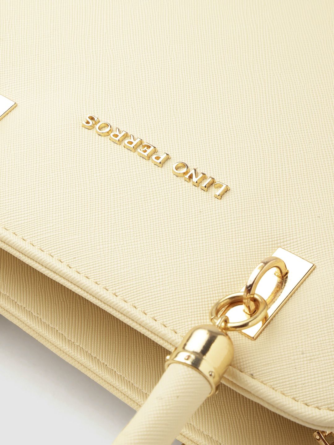 Lino Perros Off-White Solid Handheld Bag