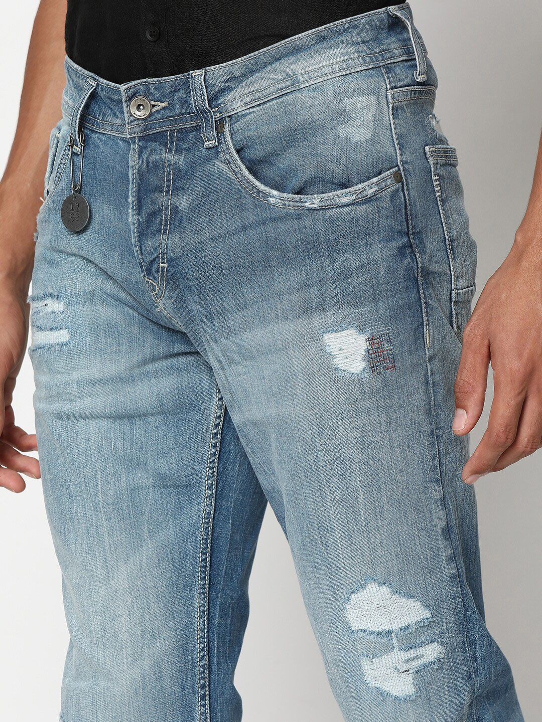 SPYKAR Men Slim Fit Low-Rise Mildly Distressed Heavy Fade Stretchable Jeans