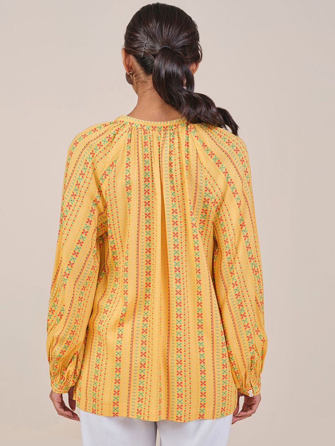 Global Desi Women Mustard Viscose Rayon Print Tie-Up Neck long Sleeves Top