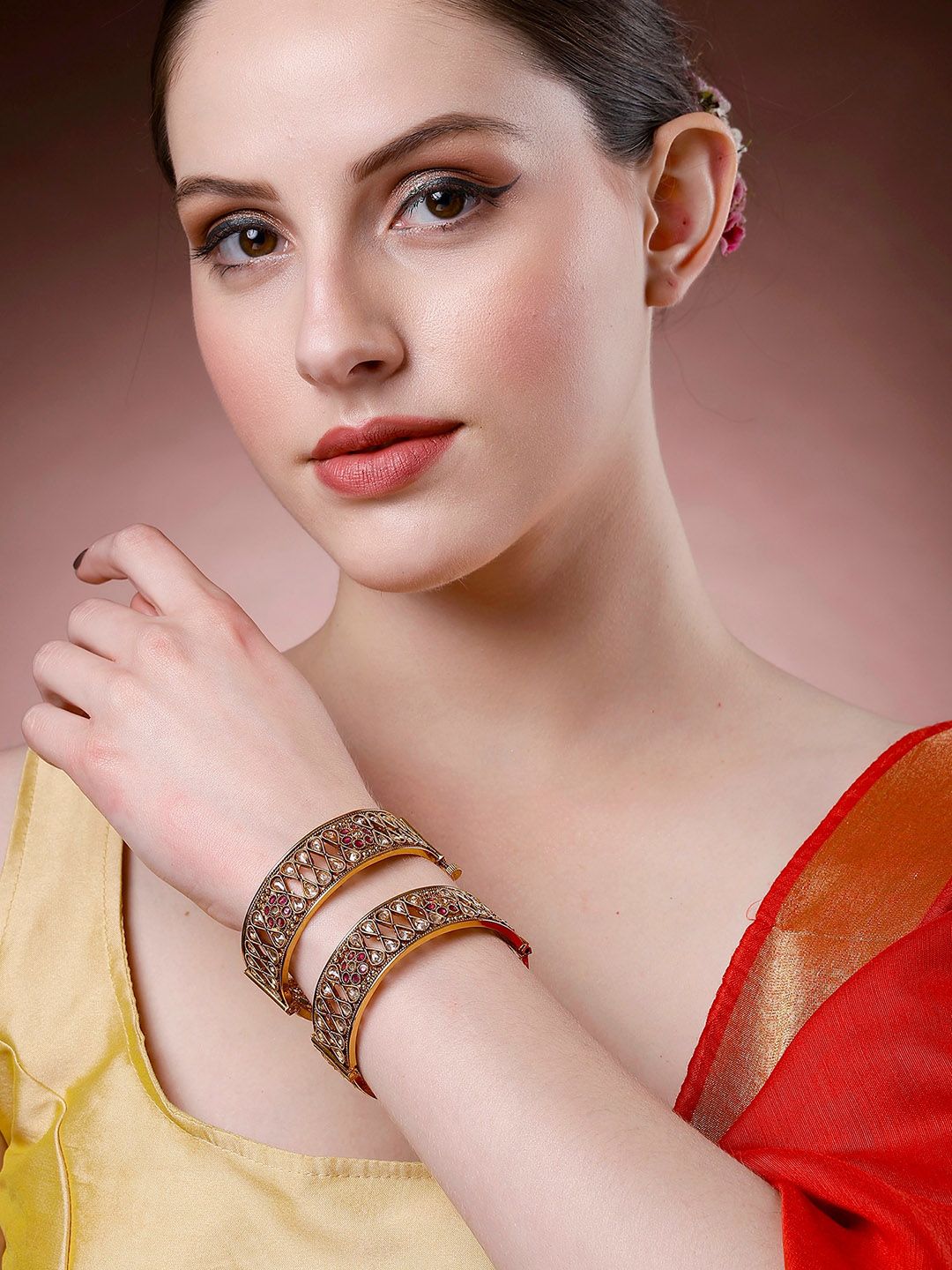 KARATCART Set of 2 Gold Plated Kundan Studded Antique Bangles