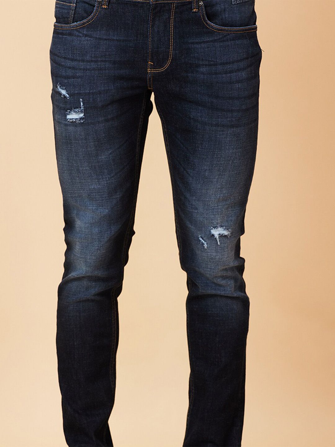 Being Human Men Skinny Fit Mid Rise Low Distress Light Fade Jeans
