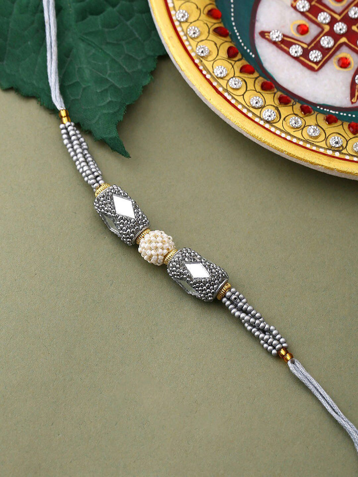Voylla Unisex Silver Beaded and Pearls Rakhi with Roli Chaawal Pack