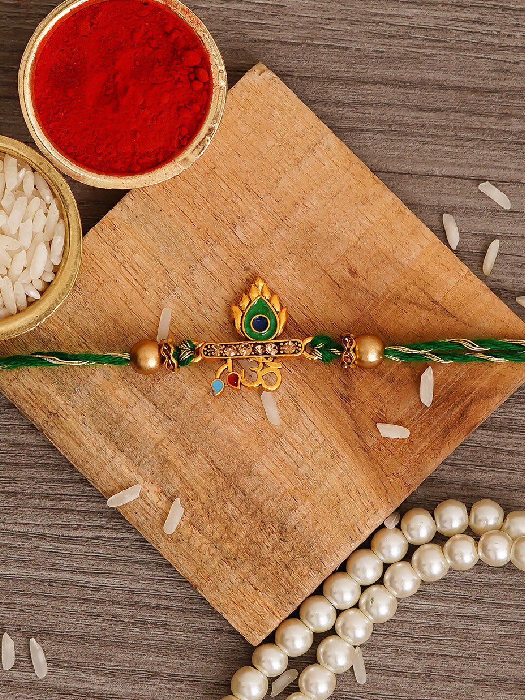 eCraftIndia Green Om & Peacock Feather Religious Rakhi with Roli Chawal