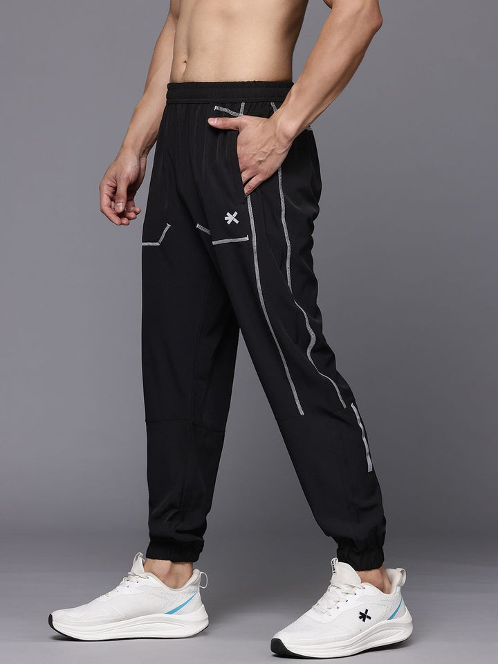 HRX oleh Hrithik Roshan Men Mid-Rise Training Joggers dengan jalur reflektif