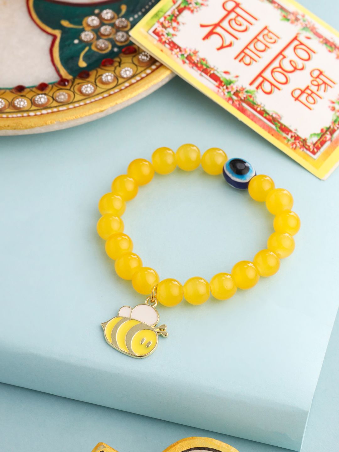 Rekaan Kartun Kanak-kanak NVR Manik Tiruan Kuning Benang Rakhi dengan Roli Chawal Chandan