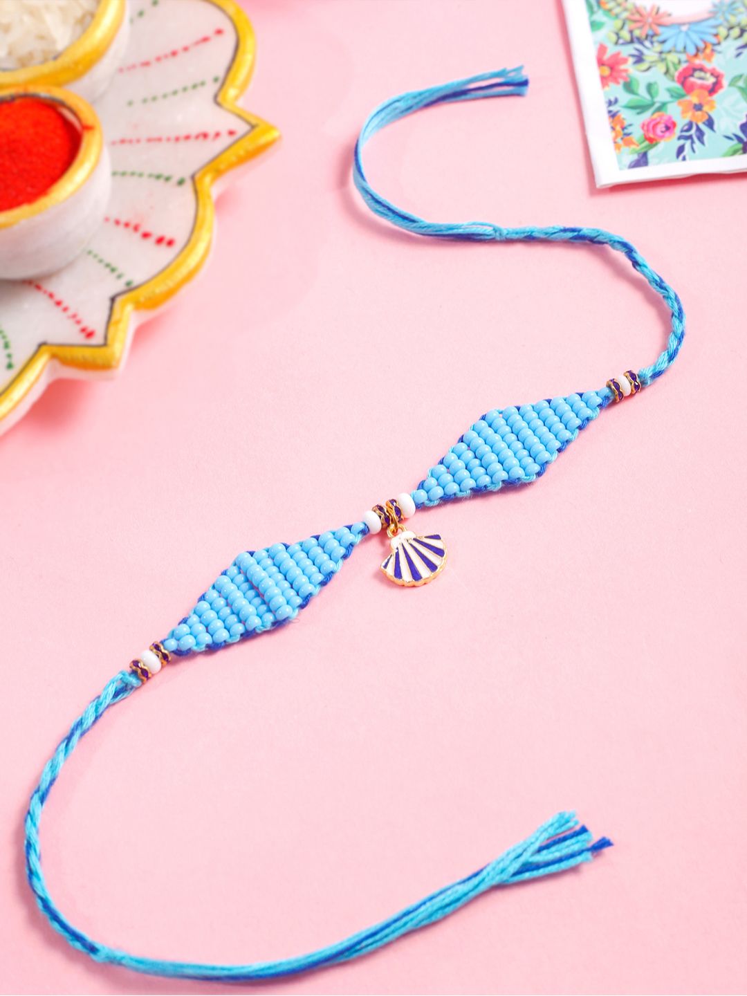 NVR Unisex Blue Pearls Unique  Thread Rakhi With Roli Chawal