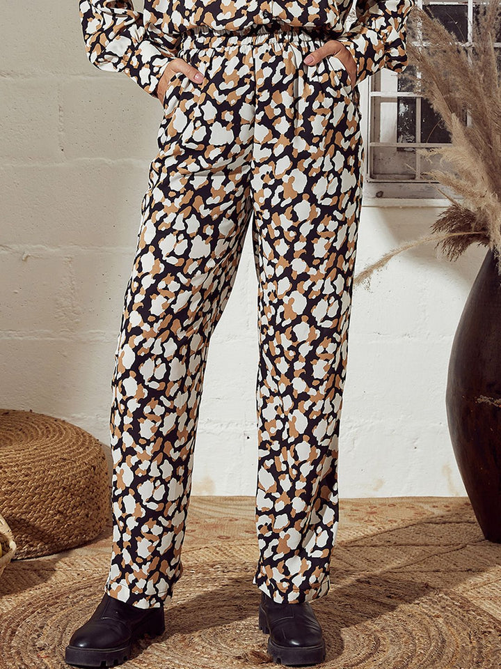 SASSAFRAS Women Beige Abstract Printed Mid-Rise Straight Trousers
