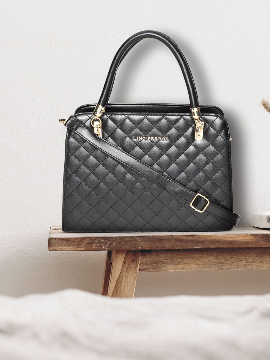 Lino Perros Black Quilted Solid Handheld Bag