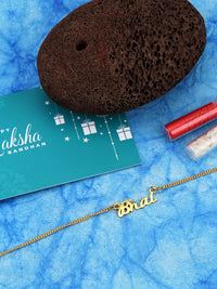 Voylla Gold-Toned Engraved with The Word 'Bhai' Rakhi Bracelet with Roli Chaawal Pack