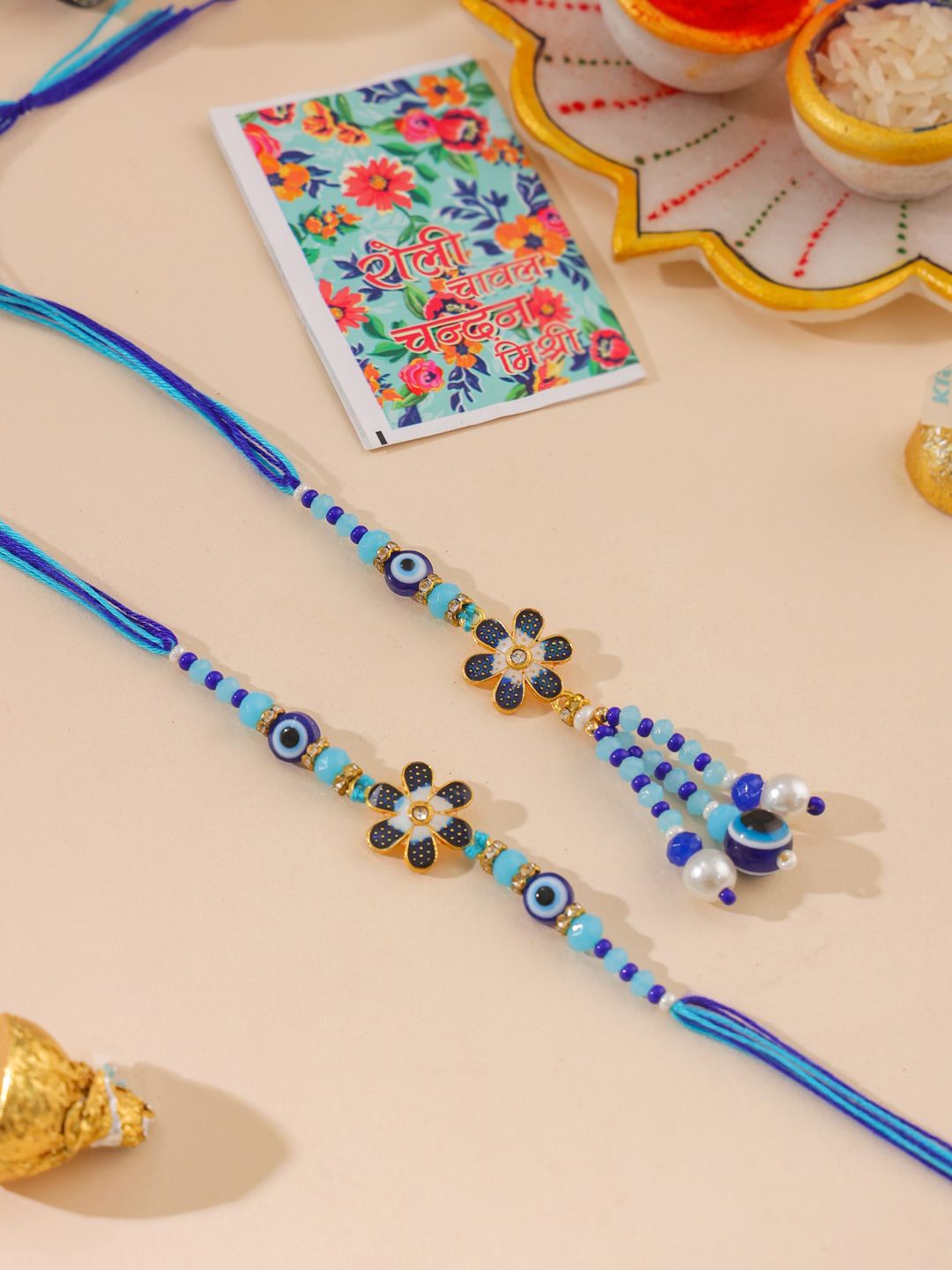 NVR Set of 2 Blue Artificial Beads Evil Eye Bhaiya Bhabhi Rakhi with Roli Chawal