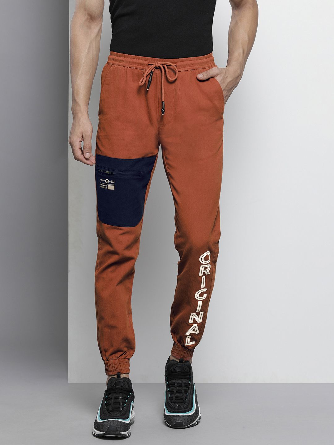 The Indian Garage Co Men Rust Orange Colourblocked Slim Fit Pleated Joggers Trousers