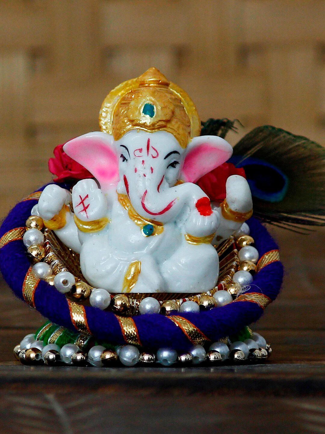 eCraftIndia Blue & White Handcrafted Lord Ganesha Idol on Floral Plate with Peacock Feather Decorative Showpiece