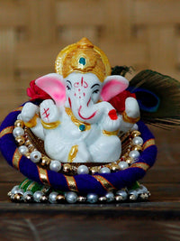 eCraftIndia Blue & White Handcrafted Lord Ganesha Idol on Floral Plate with Peacock Feather Decorative Showpiece