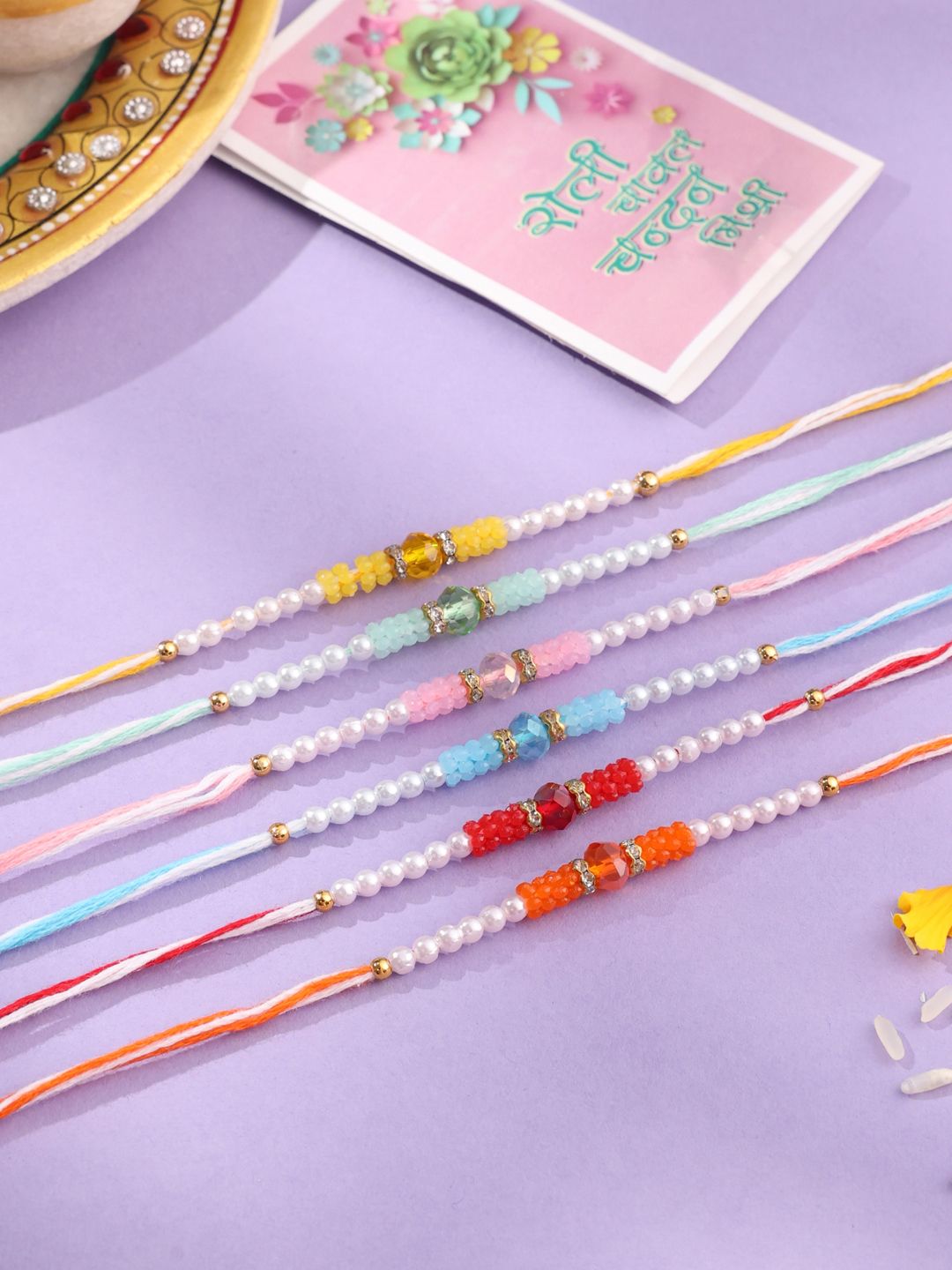 NVR Unisex Set of 6 Multicolor Artificial Stones & Pearls Rakhi With Roli Chawal