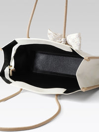 Lino Perros Textured Shoulder Bag with Bow Detail
