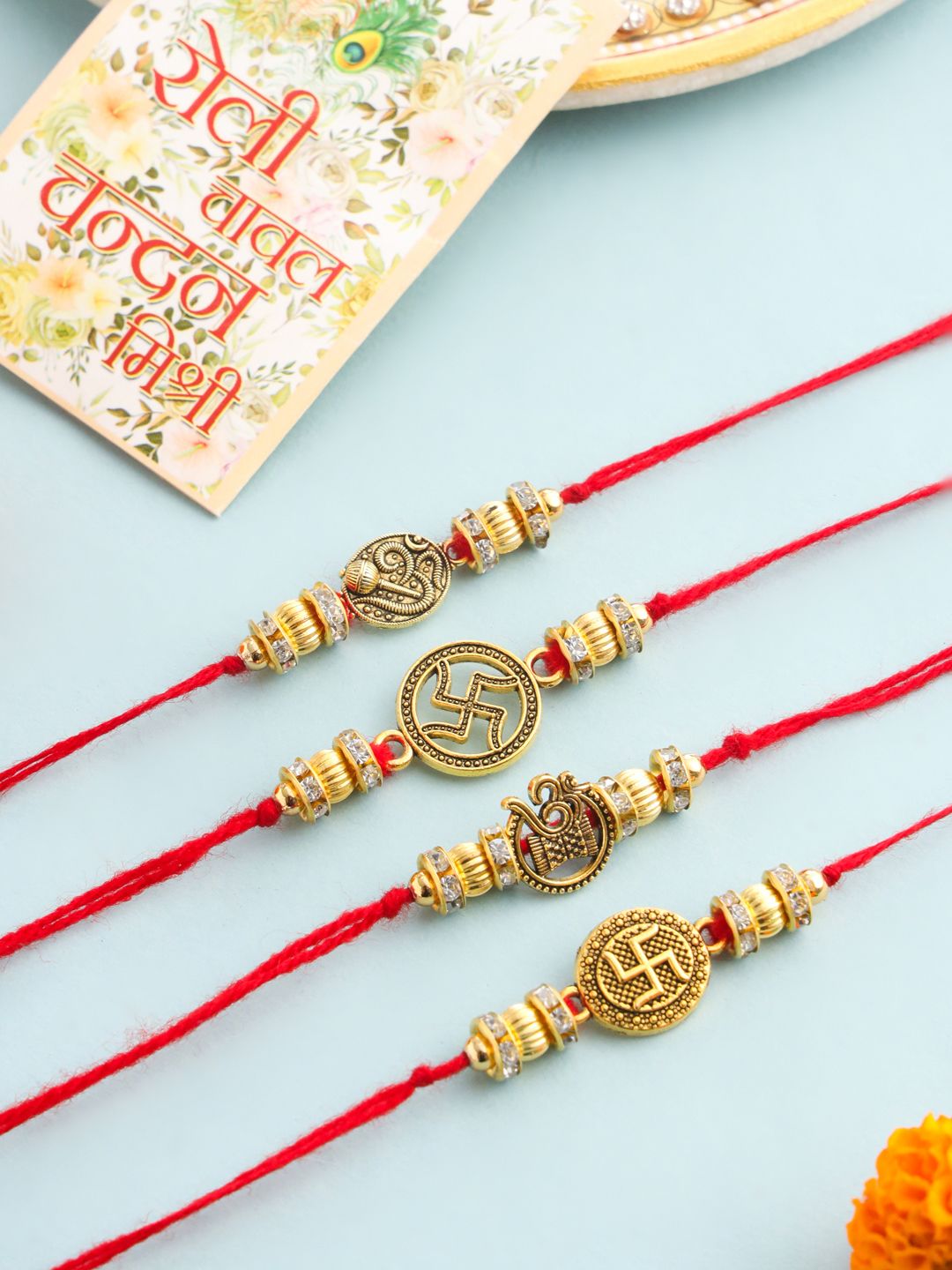 NVR Unisex Set of 4 Artificial Stones Swastik Thread Rakhi with Roli Chawal Chandan Mishri