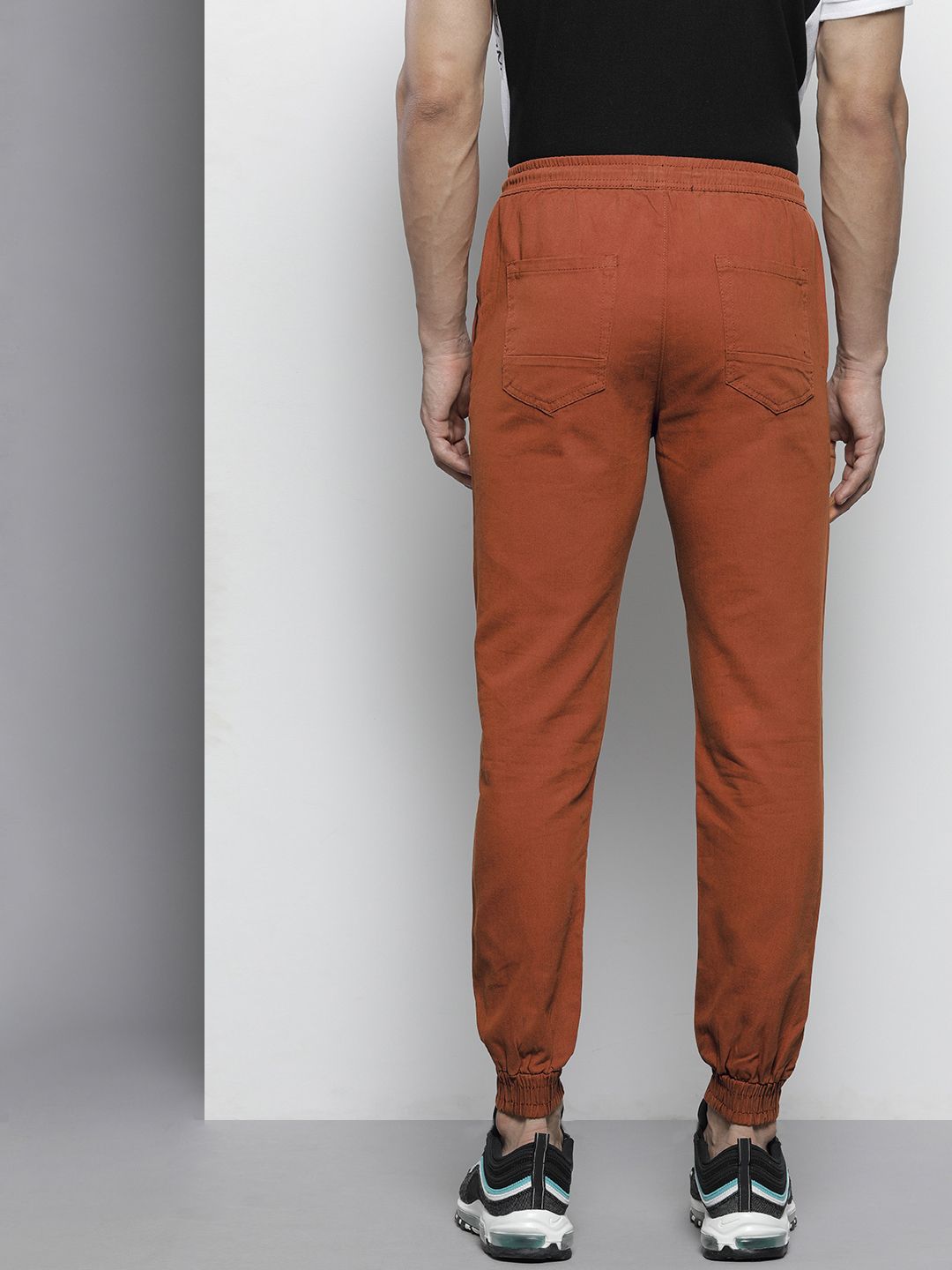 The Indian Garage Co Men Rust Orange Colourblocked Slim Fit Pleated Joggers Trousers