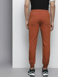 The Indian Garage Co Men Rust Orange Colourblocked Slim Fit Pleated Joggers Trousers