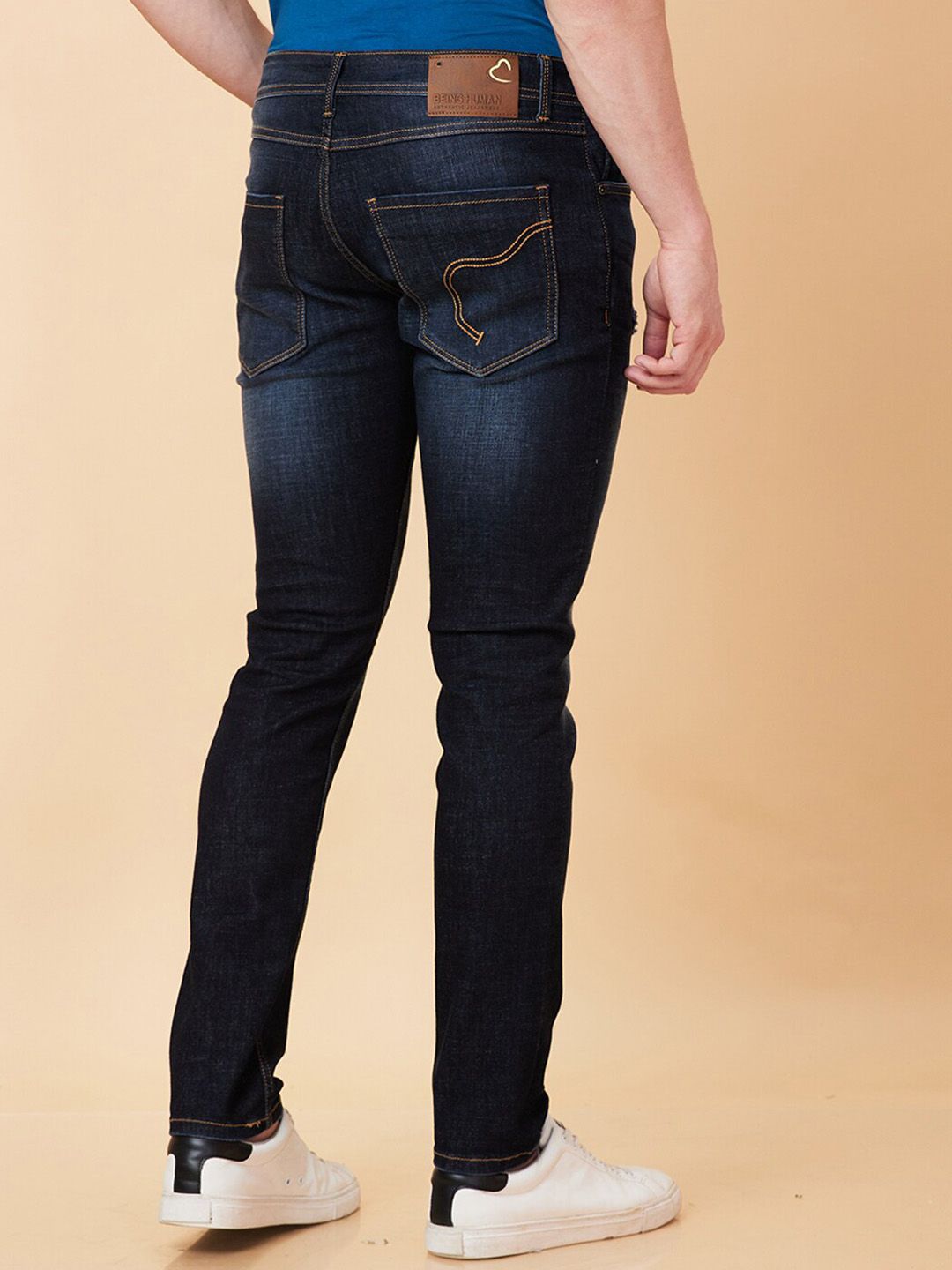 Being Human Men Skinny Fit Mid Rise Low Distress Light Fade Jeans