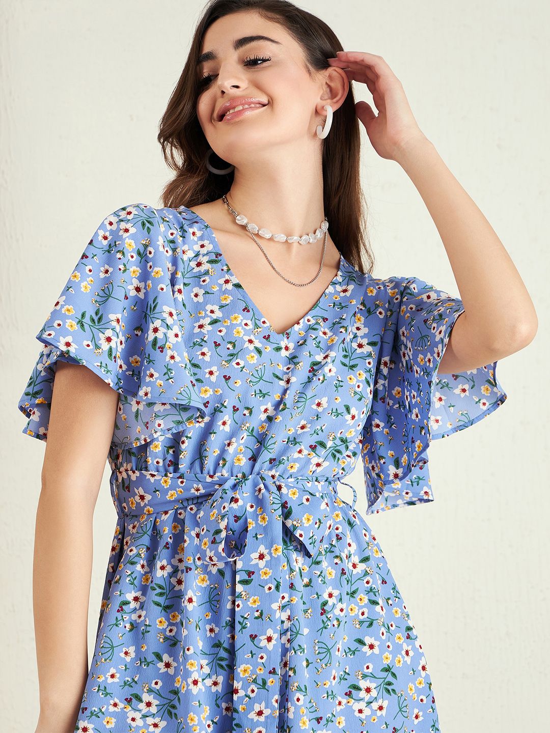 Berrylush Blue Floral Printed V-Neck Flared Sleeves Playsuit With Belt