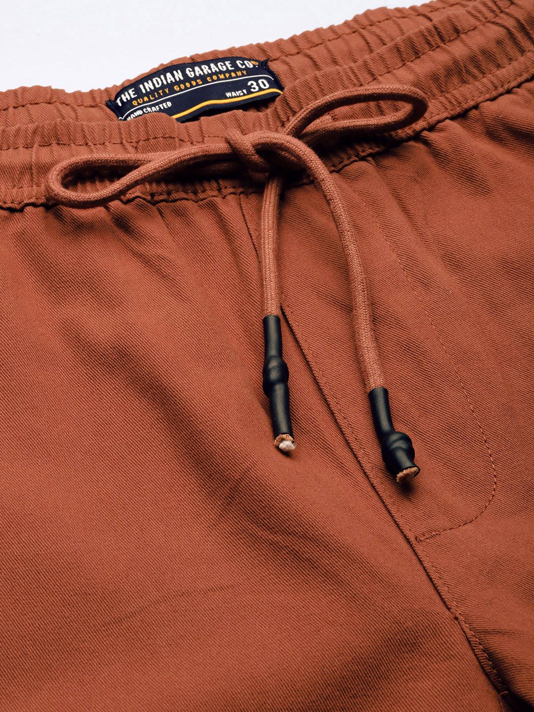 The Indian Garage Co Men Rust Orange Colourblocked Slim Fit Pleated Joggers Trousers