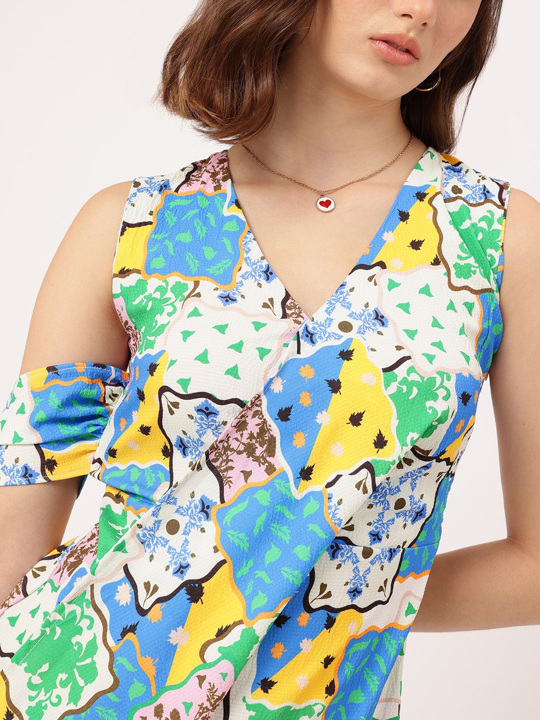 DressBerry Cute & Confident Printed Sleeveless Layered & Pleated Wrap Mini Dress