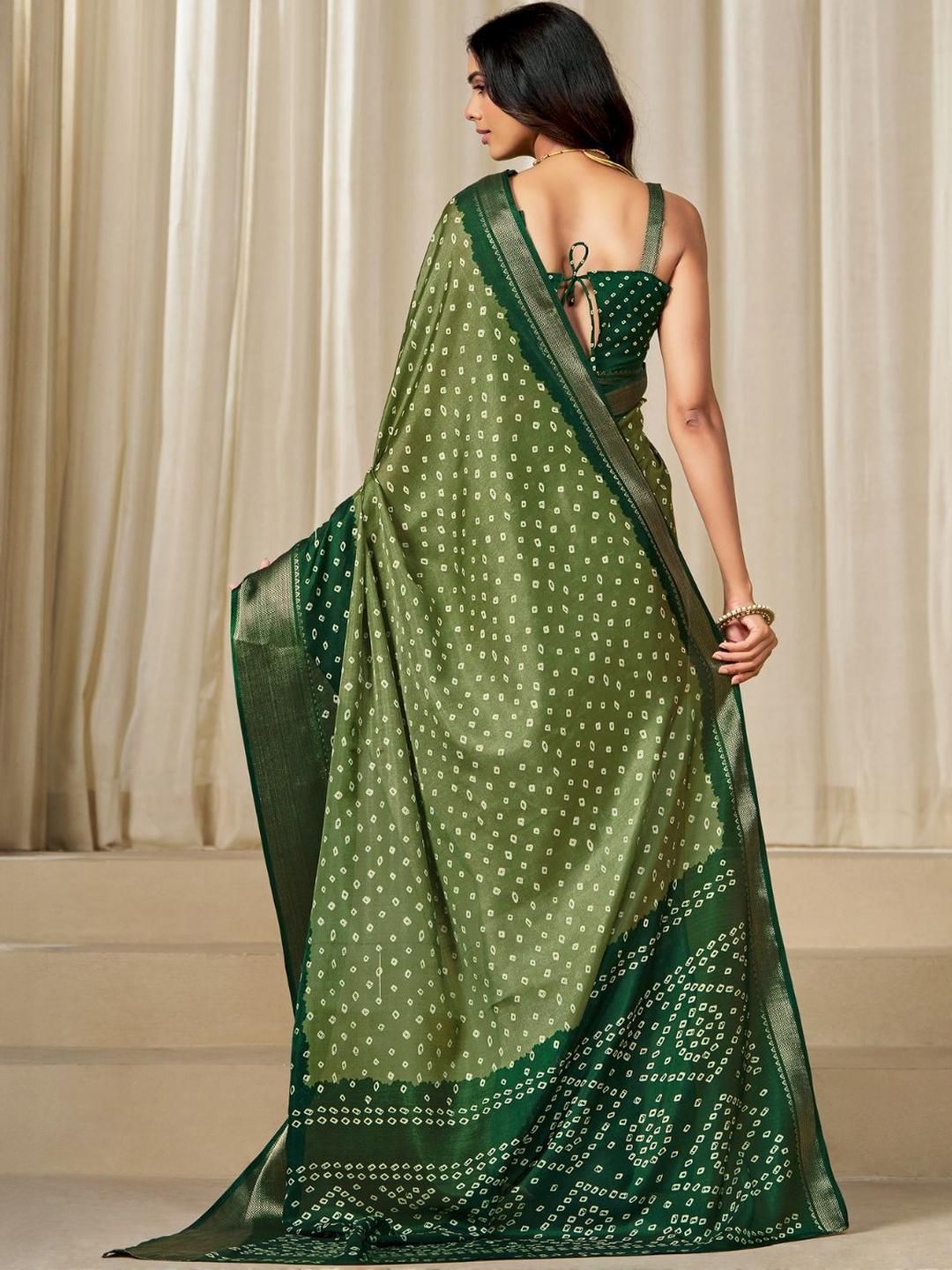 Kalini Women Dola Silk Bandhani Print Zari border Saree