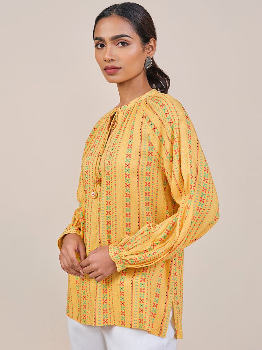 Global Desi Women Mustard Viscose Rayon Print Tie-Up Neck long Sleeves Top