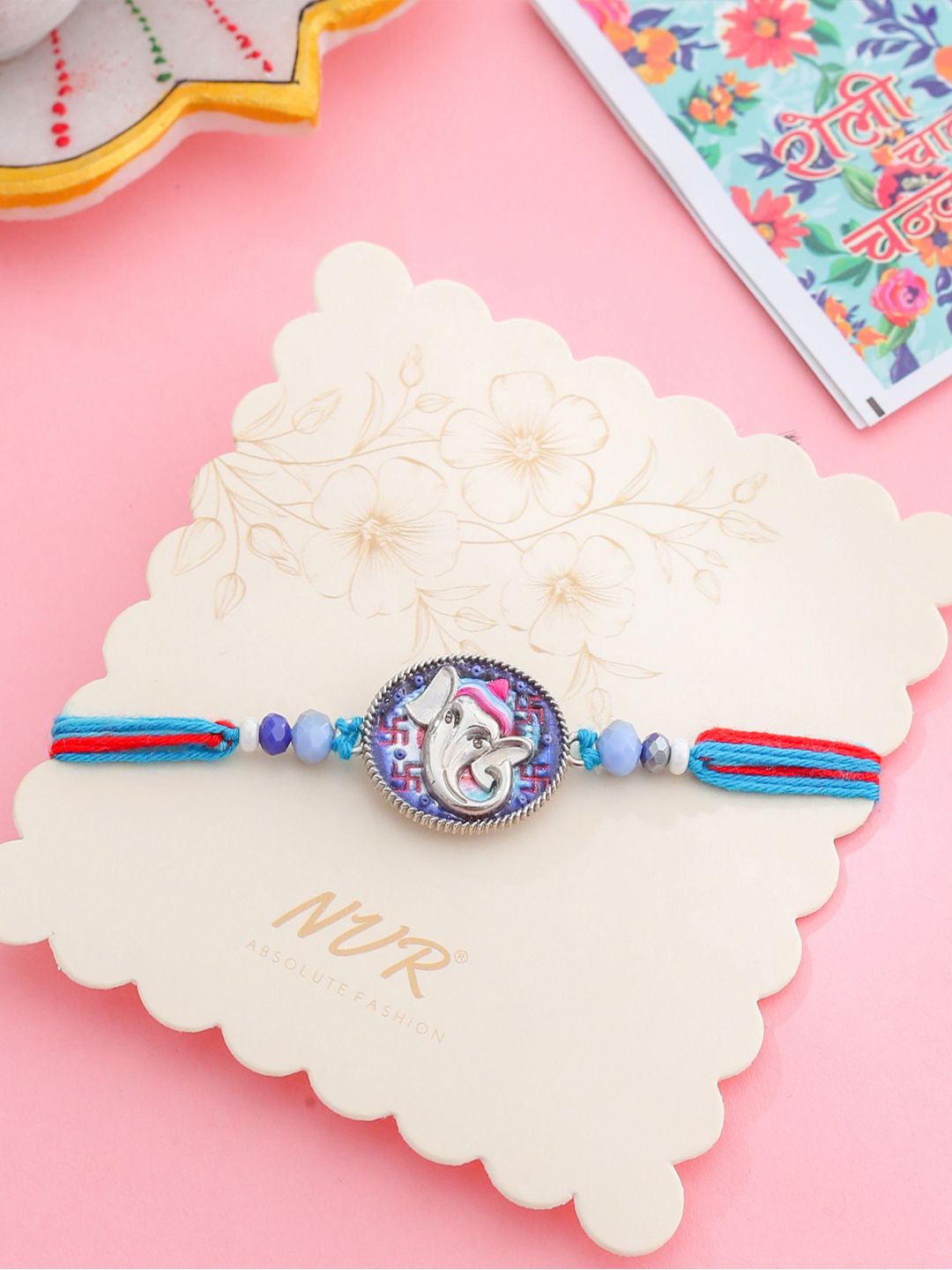 NVR Unisex Red & Blue Ganesh Ji Thread Rakhi With Roli Chawal
