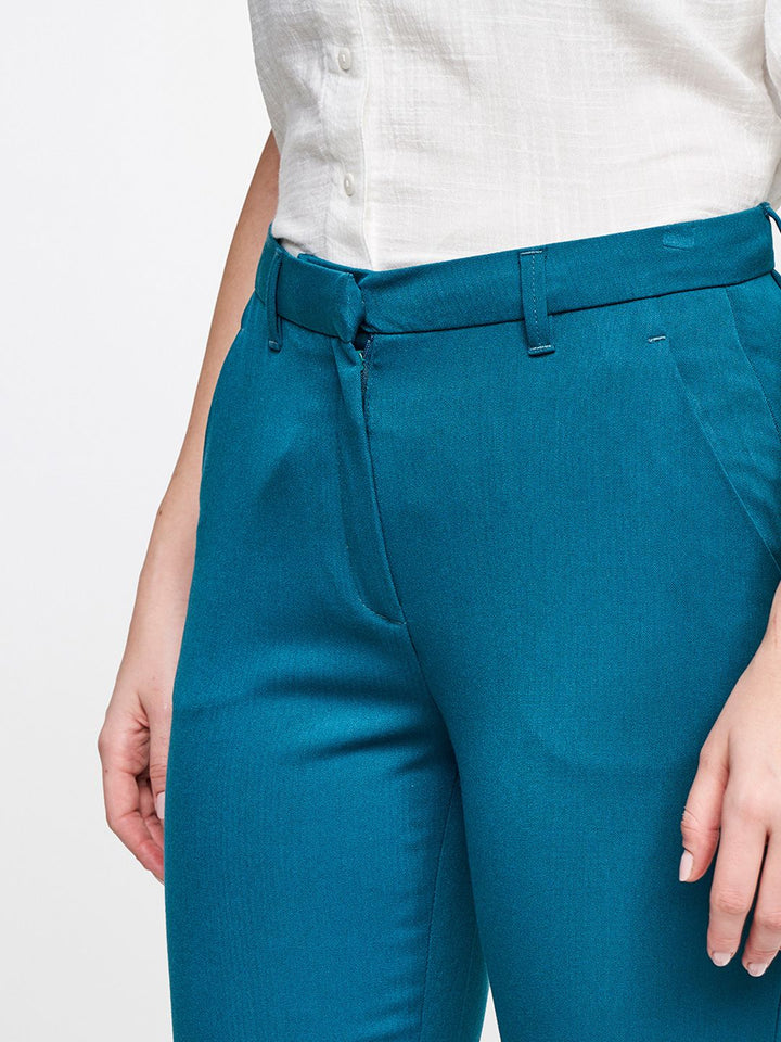 AND Women Teal Solid Casual Tapered Fit Trousers