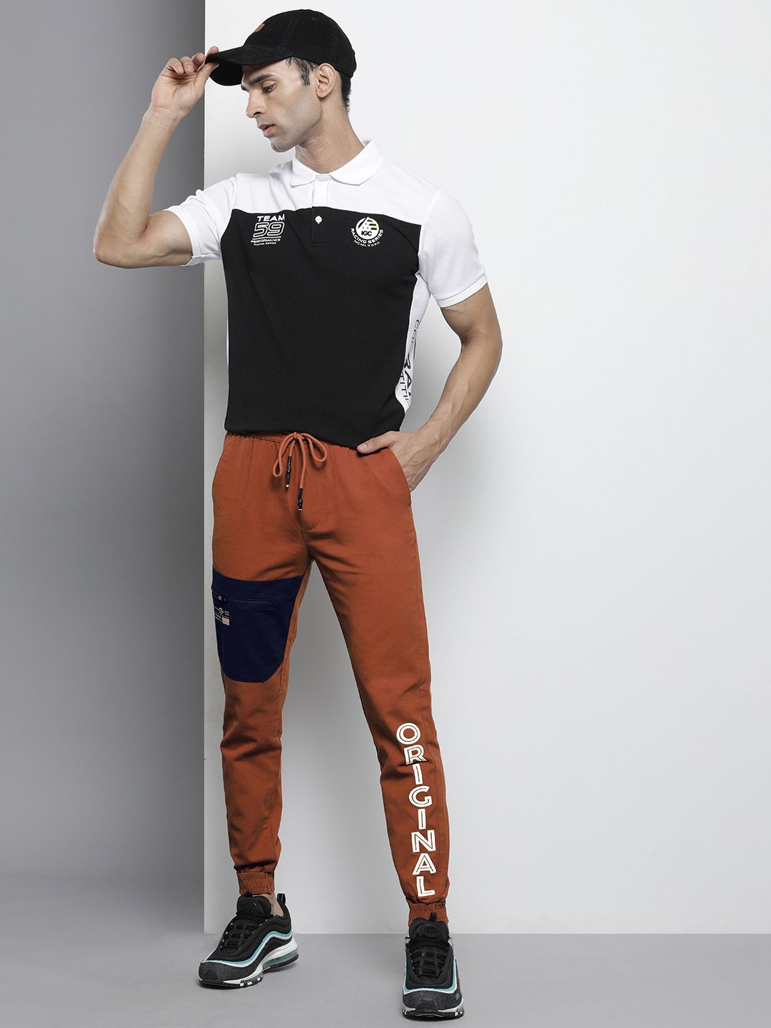The Indian Garage Co Men Rust Orange Colourblocked Slim Fit Pleated Joggers Trousers