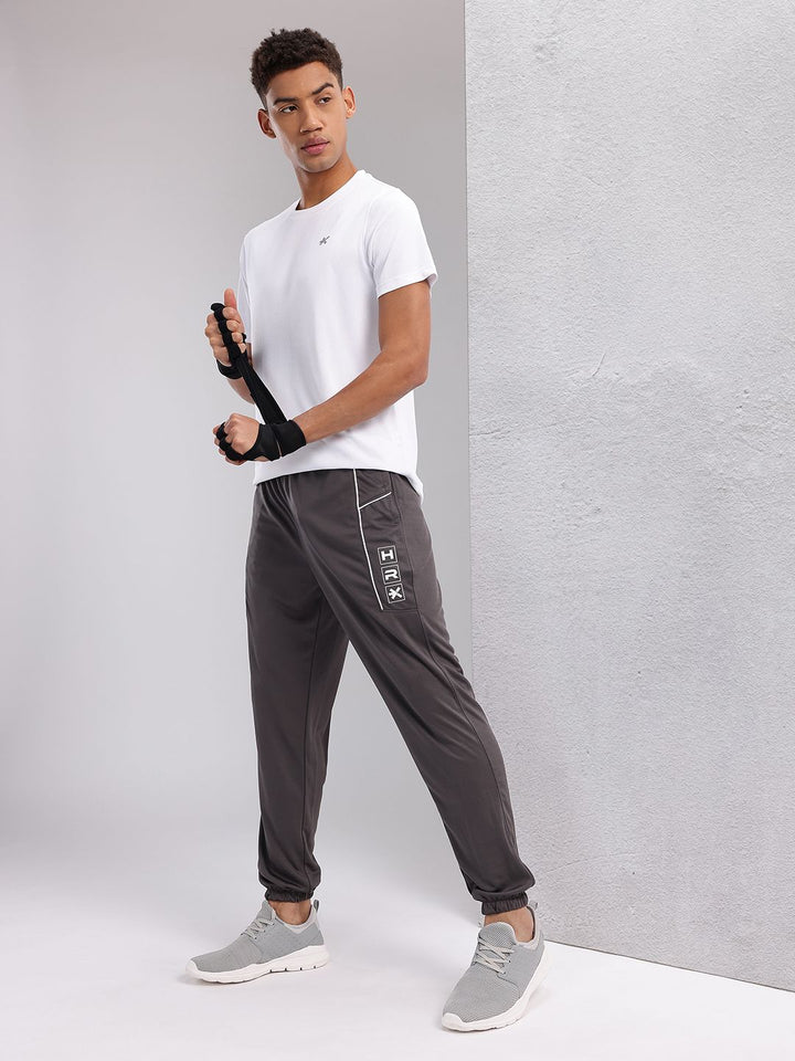 HRX by Hrithik Roshan Men Brand Logo Printed Mid-Rise Rapid-Dry Training Joggers