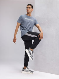 HRX by Hrithik Roshan Men Brand Logo Printed Mid-Rise Rapid-Dry Running Joggers
