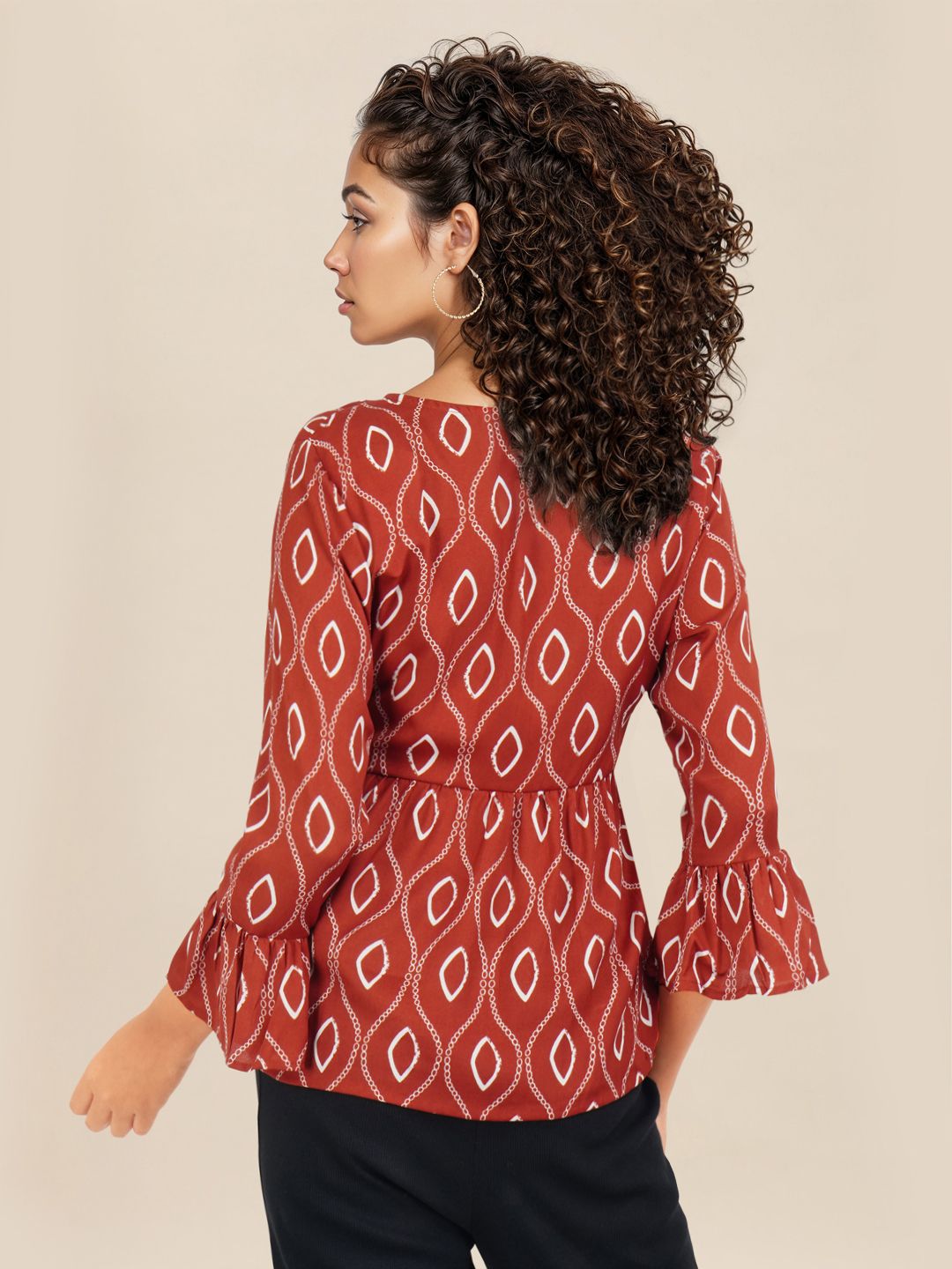 DressBerry Printed Tie-Up Neck Bell Sleeve Peplum Top