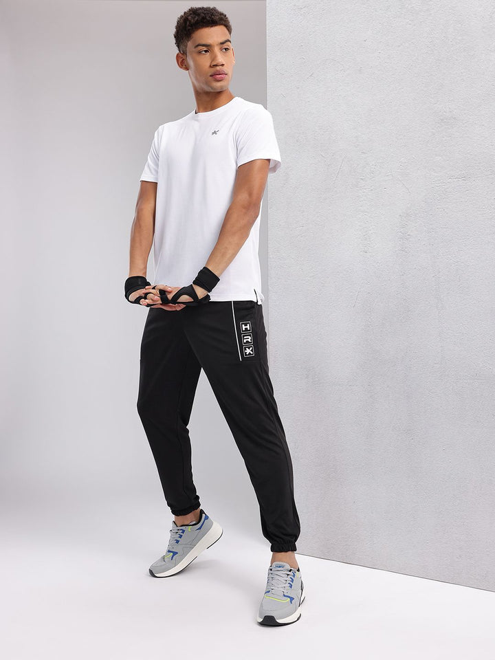 HRX by Hrithik Roshan Men Brand Logo Printed Mid-Rise Rapid-Dry Training Joggers
