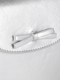 DressBerry Textured Structured Sling Bag with Bow Detail
