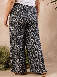 Berrylush Curve Women Black Floral Printed Relaxed High-Rise Parallel Trousers