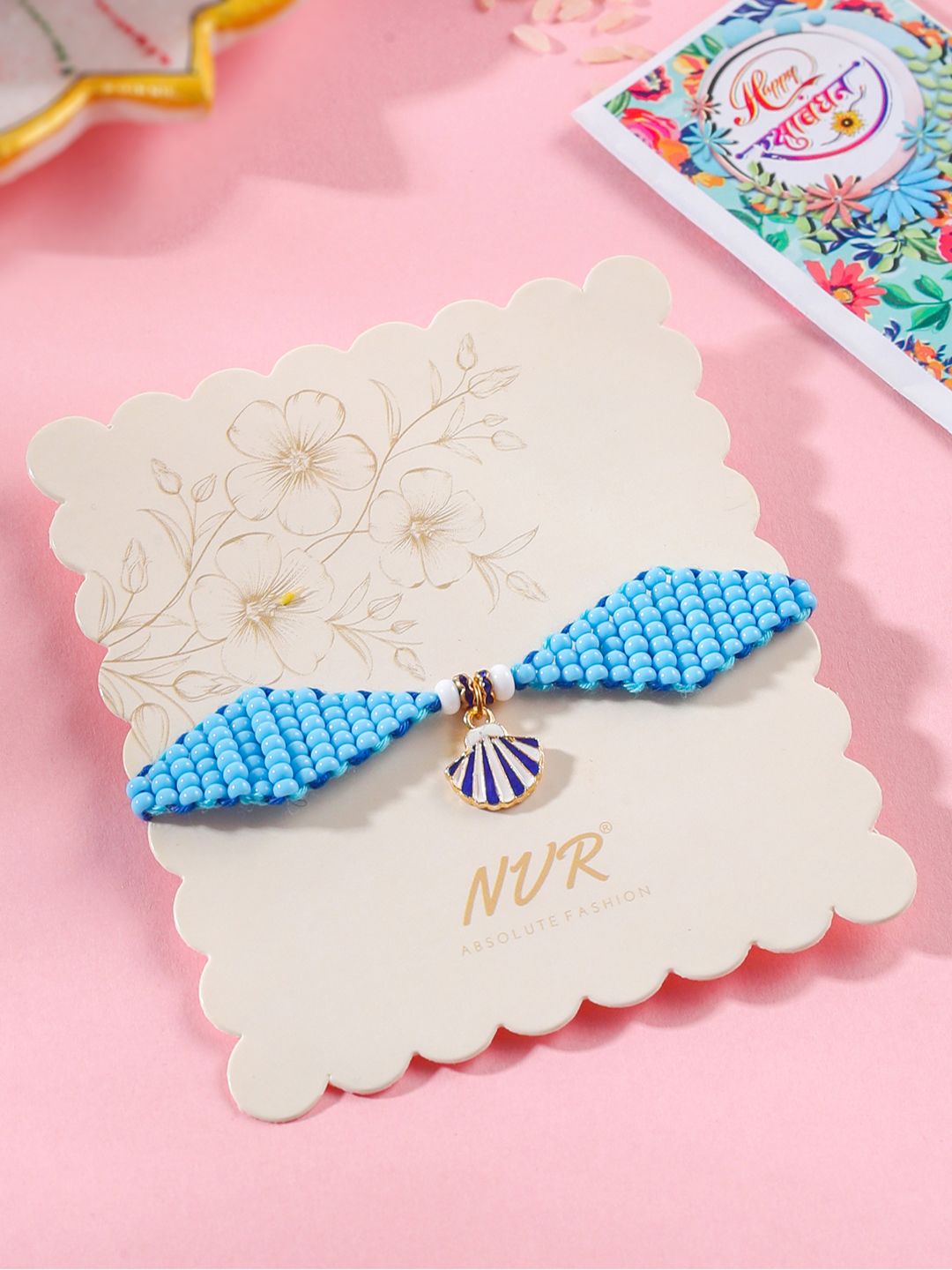 NVR Unisex Blue Pearls Unique  Thread Rakhi With Roli Chawal