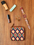 TEAL BY CHUMBAK Geometric Printed Foldover Clutch