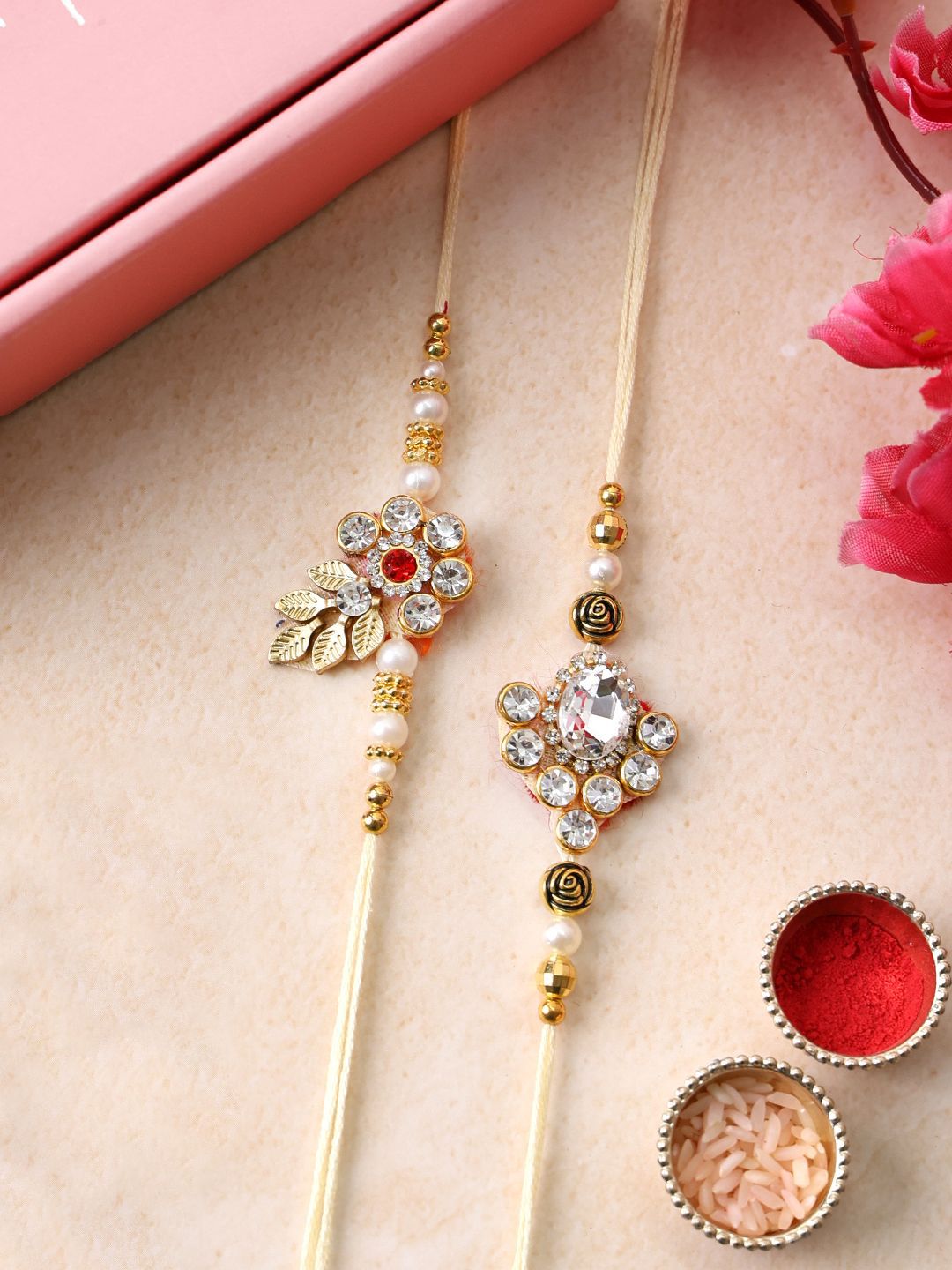 PANASH Set Of 2 Gold Plated Floral Shaped Rakhis with Roli Chawal With Roli Chawal